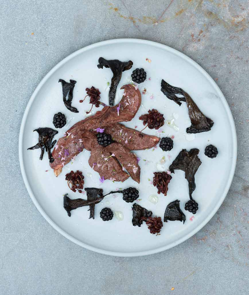 Grilled deer heart with black trumpets, blackberries, and pickled wild onions
