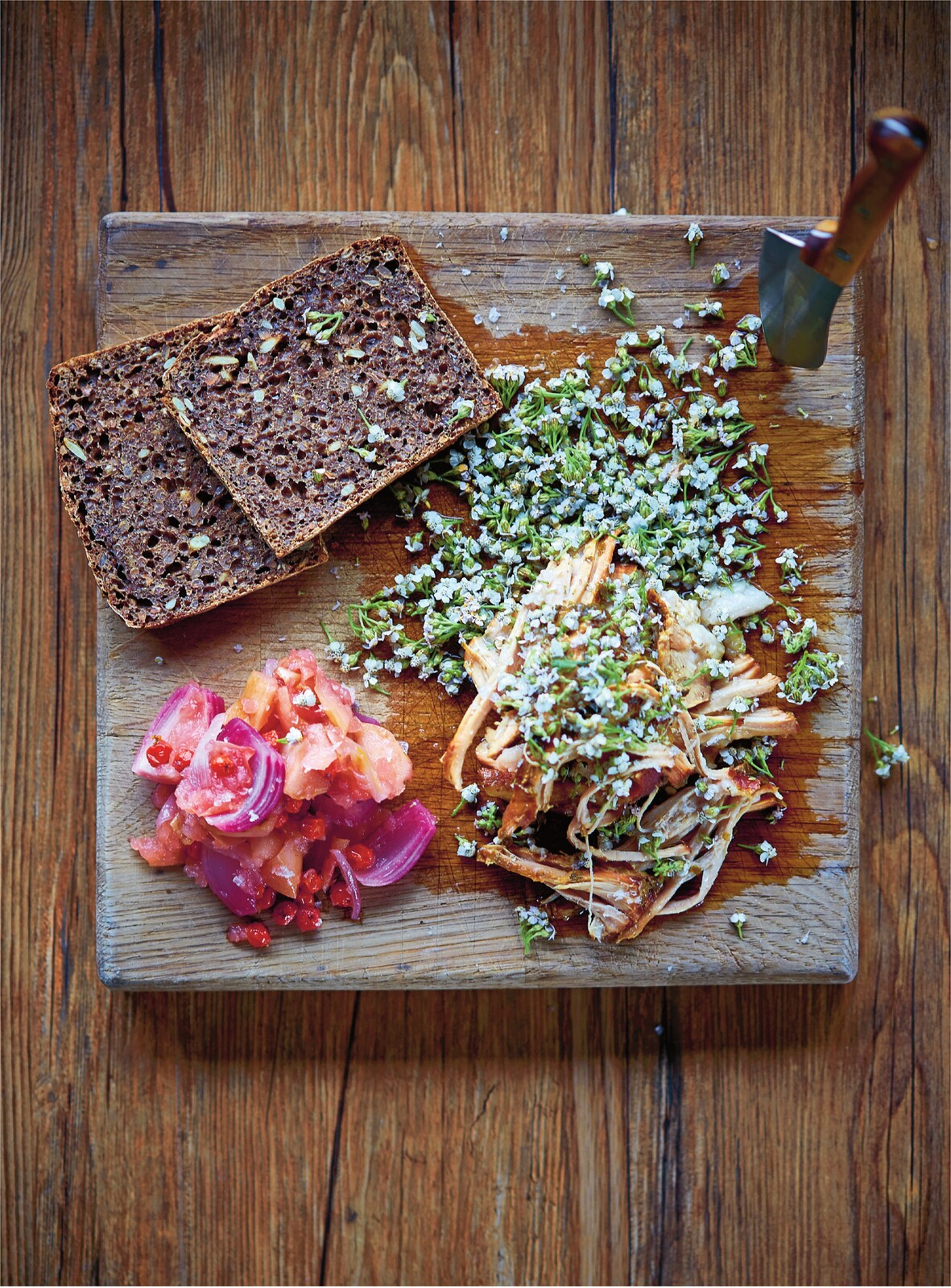 Pork shoulder in yarrow with crab apple and rowan berry compote, toasted rye bread and yarrow flowers